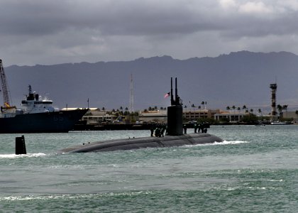 US Navy 100408-N-3560G-001 The Los Angeles-class submarine USS Tucson (SSN 770) departs Joint Base Pearl Harbor-Hickam for a scheduled deployment to the western Pacific region photo