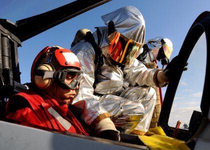 US Navy 100403-N-3885H-092 Members of the air department crash and salvage team aboard the aircraft carrier USS George H.W. Bush (CVN 77) practice rescuing a pilot during a drill on the flight deck