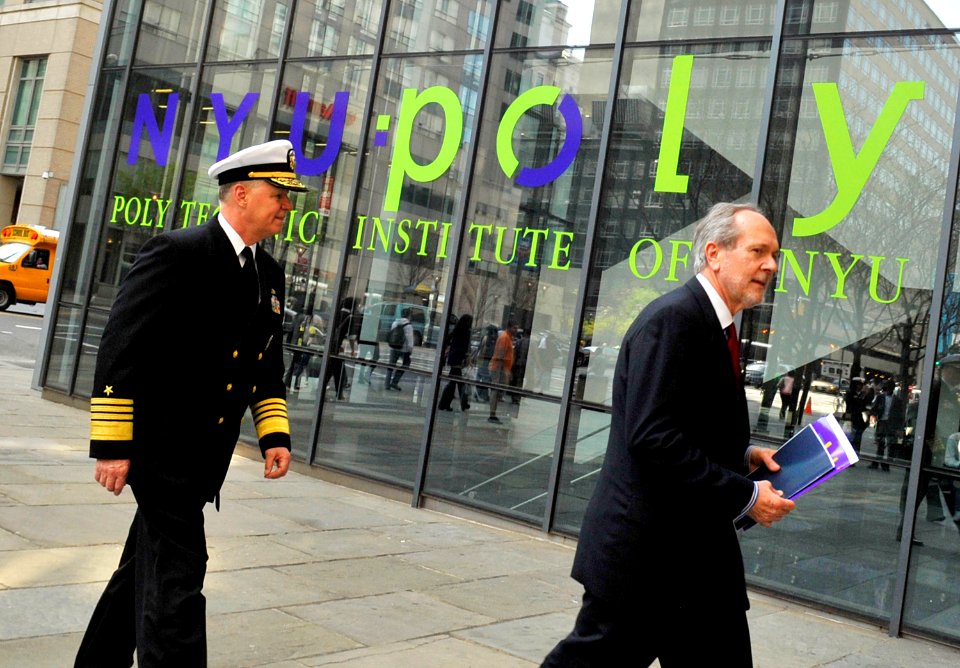 US Navy 100408-N-8273J-104 Chief of Naval Operations (CNO) Adm. Gary Roughead receives a tour by Polytechnic Institute of New York University President Jerry Hultin while meeting with students on the campus in Brooklyn, N.Y