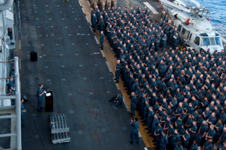 US Navy 100405-N-8936G-042 Sailors aboard the amphibious assault ship USS Nassau (LHA 4) listen to Capt. John Bruening