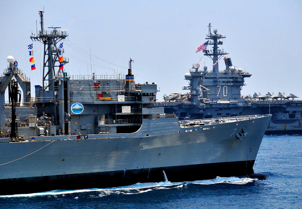 US Navy 100407-N-4774B-456 The Military Sealift Command fast combat support ship USNS Rainier (T-AOE 7) pulls alongside the Nimitz-class aircraft carrier USS Carl Vinson (CVN 70) during a formation exercise