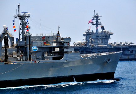 US Navy 100407-N-4774B-456 The Military Sealift Command fast combat support ship USNS Rainier (T-AOE 7) pulls alongside the Nimitz-class aircraft carrier USS Carl Vinson (CVN 70) during a formation exercise