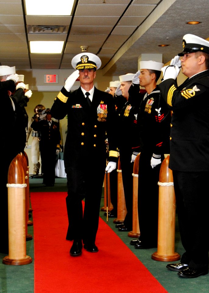 US Navy 100409-N-9095H-029 Rear Adm. Michael Tillotson renders a salute while being piped aboard during a change of command ceremony for Navy Expeditionary Combat Command (NECC)