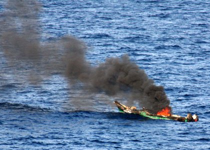 US Navy 100410-N-6110S-194 A suspected pirate skiff burns after being destroyed by the amphibious dock landing ship USS Ashland (LSD 48)