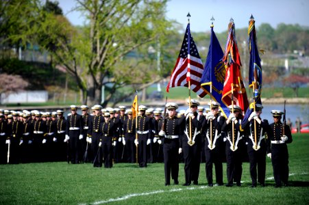 US Navy 100407-D-7203C-007 Midshipmen post the colors at the U.S. Naval Academy in Annapolis, Md. during a parade honoring Secretary of Defense Robert M. Gates