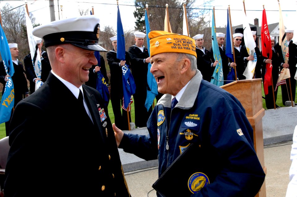 US Navy 100410-N-9818V-057 Master Chief Petty Officer of the Navy (MCPON) Rick West talks with Thomas Russell III at a memorial service