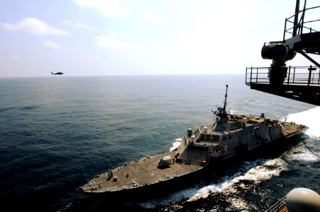 US Navy 100407-N-4275C-148 The littoral combat ship USS Freedom (LCS 1) refuels from the Nimitz-class aircraft carrier USS Carl Vinson (CVN 70) during a refueling at sea photo