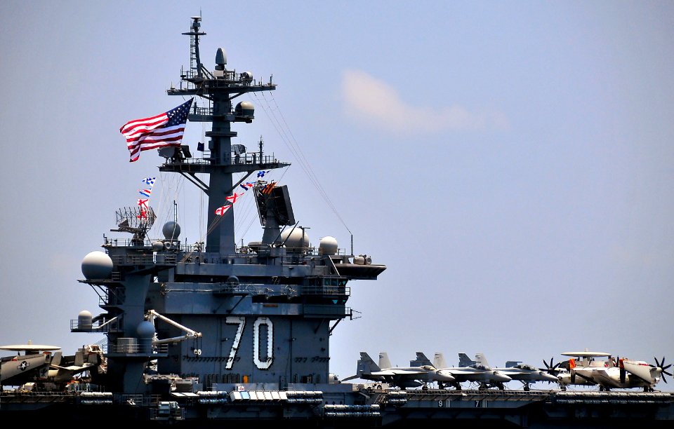 US Navy 100407-N-4774B-480 The Nimitz-class aircraft carrier USS Carl Vinson (CVN 70) flies the battle ensign during a formation exercise