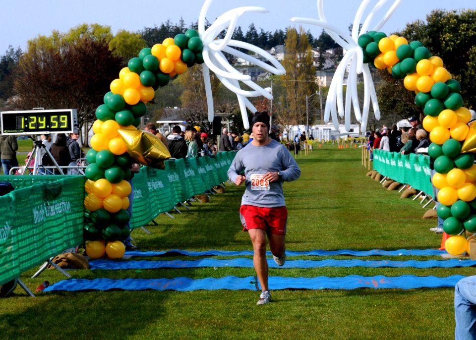 US Navy 100411-N-9860Y-008 Lt. Zachary Scheetz crosses the finish line as he completes a half-marathon at Windjammer Park during the 9th Annual Whidbey Island Marathon-Half-Marathon