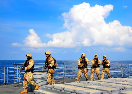 US Navy 100407-N-4774B-297 Members of a visit, board, search and seizure team from the littoral combat ship USS Freedom (LCS 1) conduct tactical exercises aboard the guided-missile cruiser USS Bunker Hill (CG 52) photo
