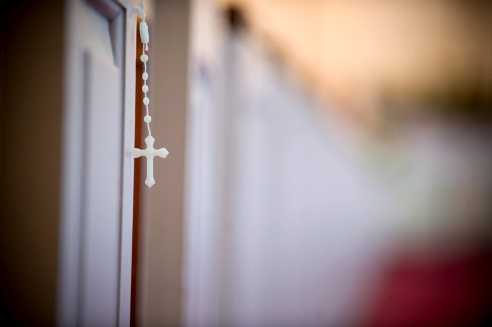 US Navy 100412-N-7090S-329 Rosary beads are visible from a pew during a Catholic Mass at Marine Corps Base Quantico, Va