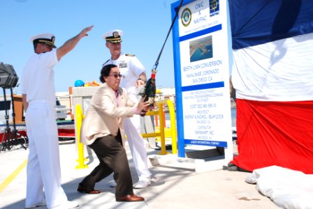 US Navy 100409-1926C-N-303 Casey Tanaka, mayor of Coronado, participates in a champagne bottle breaking ceremony for the berth at Lima Pier photo