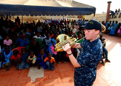 US Navy 100408-N-6138K-138 Musician 2nd Class Allison Baine performs for more than 300 children at the Colin Powell Cultural Center