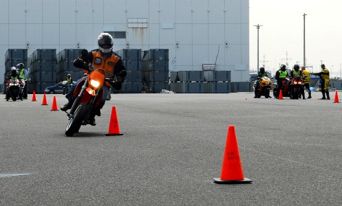 US Navy 100410-N-2218S-001 Service members ride motorcycles through an obstacle course during the Navy and Marine Corps traffic skills training rodeo at North Dock Yokohama