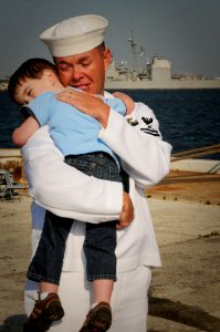 US Navy 100415-N-1522S-007 Gunner's Mate 2nd Class Kiley McDowell embraces his son during the homecoming of the guided-missile frigate USS McInerney (FFG 8)