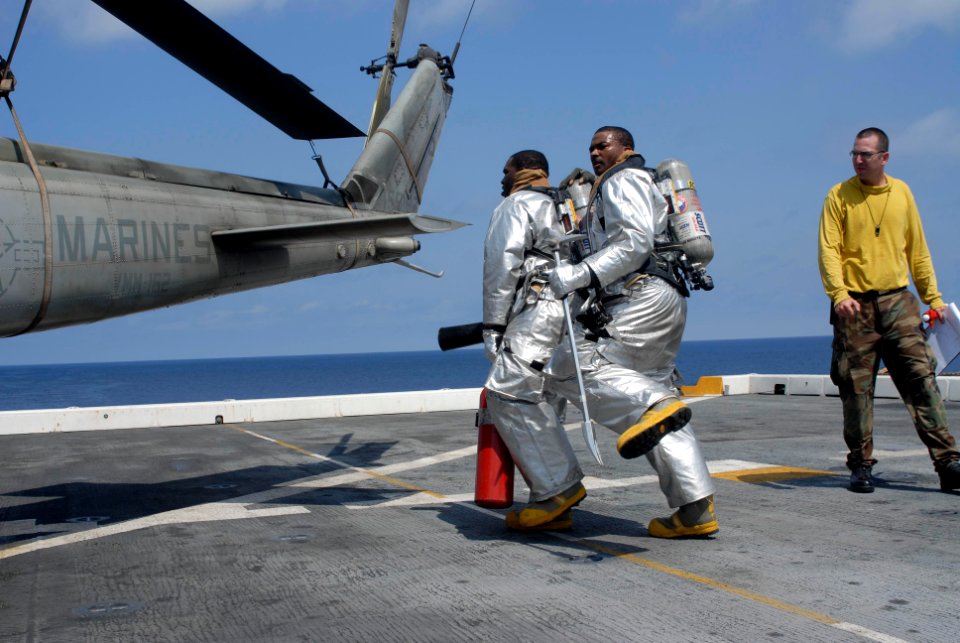US Navy 100415-N-3358S-011 Aviation Boatswain's Mate (Handling) 1st Class Bradley Grayson supervises sailors during a fire drill aboard the amphibious transport dock ship USS Mesa Verde (LPD 19)