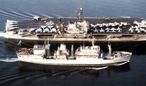 USNS Saturn (T-AFS-10) replenishes USS America (CV-66) c1992