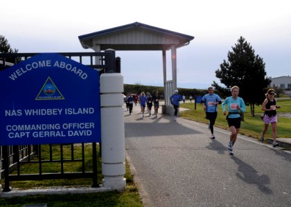US Navy 100411-N-9860Y-002 Runners exit through Maui Gate at Naval Air Station (NAS) Whidbey Island Seaplane Base during the 9th Annual Whidbey Island Marathon-Half-Marathon