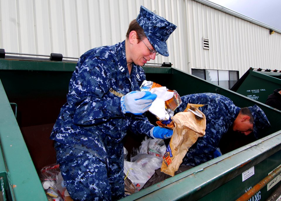 US Navy 100414-N-9520G-003 Lt. Julie Cunningham and Aviation Structural Mechanic (Equipment) Airman James Creek eparate regular trash from recyclables