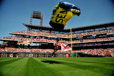 US Navy 100412-N-6003P-341 Aircrew Survival Equipmentman 1st Class Thomas Kinn parachutes into Citizens Bank Park with a Phillies flag during the opening ceremony of the Philadelphia Phillies 2010 season photo