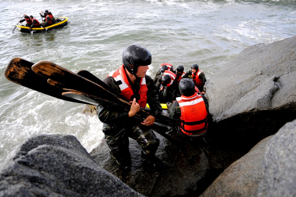 US Navy 100413-N-7883G-124 Students from Basic Underwater Demolition-SEAL class 282 participate in Rock Portage at Coronado Island