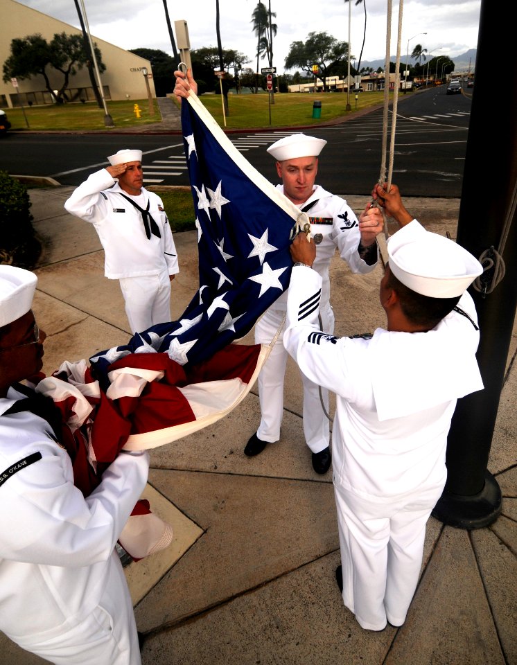 US Navy 100415-N-7586L-089 Sailors assigned to Joint Base Pearl Harbor-Hickam prepare to raise the flag during morning colors