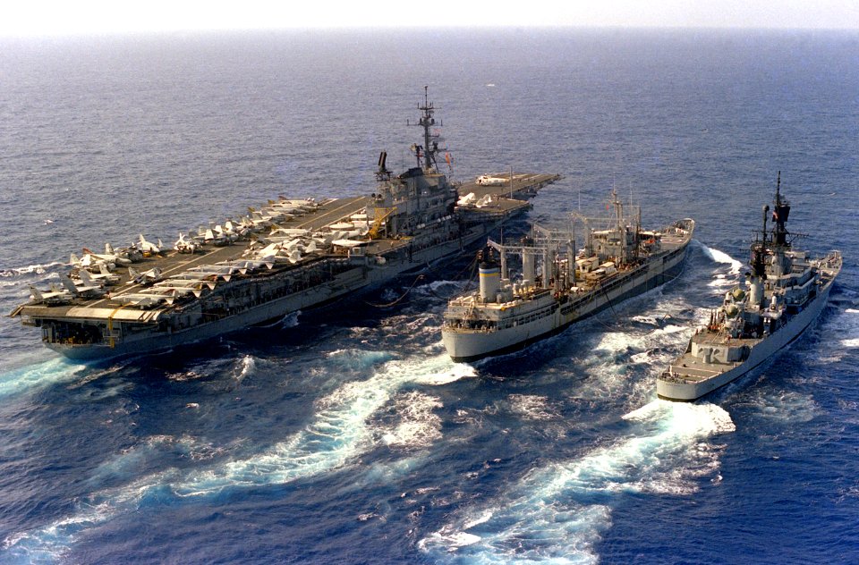 USNS Navasota (T-AO-106) refuels USS Midway (CV-41) and USS England (CG-22) on 7 December 1983 (6483143)