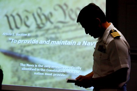 US Navy 100415-N-8863V-143 Capt. Jay Kadowaki, commanding officer of Naval Surface Warfare Center (NSWC), Corona Division, reads the Navy's mandate from the U.S. Constitution