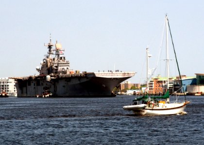 US Navy 100412-N-4649B-049 The multipurpose amphibious assault ship USS Bataan (LHD 5) approaches the BAE Systems Norfolk Ship Repair facility to undergo a four-month planned maintenance availability photo