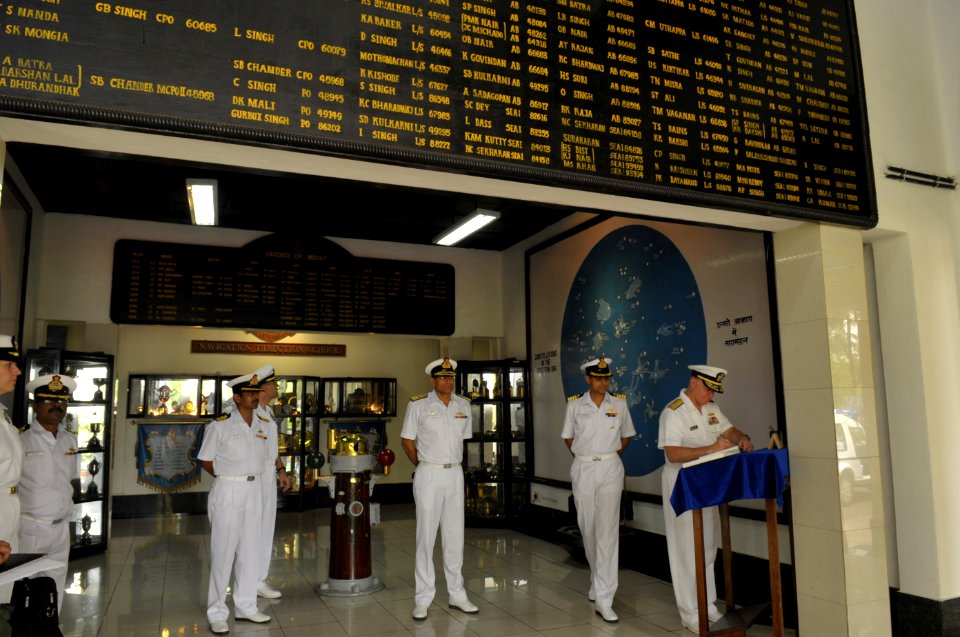 US Navy 100415-N-8273J-067 Chief of Naval Operations (CNO) Adm. Gary Roughead, left, signs a guest book while touring the Navigation and Direction School at INS Garuda in Cochin, India