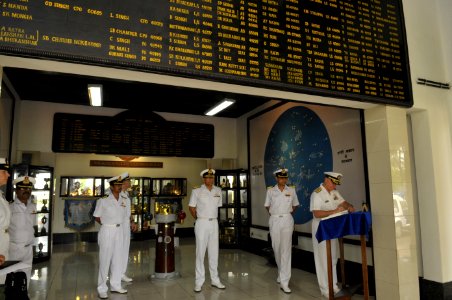 US Navy 100415-N-8273J-067 Chief of Naval Operations (CNO) Adm. Gary Roughead, left, signs a guest book while touring the Navigation and Direction School at INS Garuda in Cochin, India photo