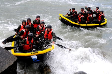 US Navy 100413-N-7883G-319 Students from Basic Underwater Demolition-SEAL class 282 participate in Rock Portage at Coronado Island photo