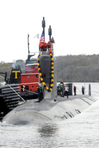 US Navy 100413-N-8467N-003 The attack submarine USS Virginia (SSN 774) pulls into Submarine Base New London after completing the first six-month deployment for a Virginia-class Submarine photo