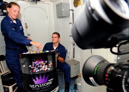 US Navy 100416-N-1082Z-051 Boatswain's Mate 2nd Class Kelli D. Dalby, from Stafford, Va., and Boatswain's Mate Seaman Mathew A. Parsons, from Ellerbe, N.C., announce numbers during a live Bingo game aboard the amphibious dock l