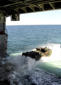 US Navy 100415-N-2147L-002 An amphibious assault vehicle from the U.S. Marine 2nd Assault Amphibious Battalion departs the well deck of the amphibious transport dock ship USS New York (LPD 21)