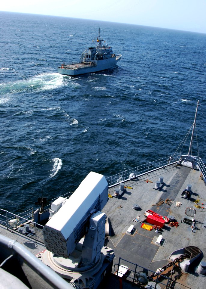 US Navy 100417-N-6138K-685 The Spanish navy Servola-class offshore patrol vessel SPS Centinela (P 72) maneuvers forward of the Whidbey Island-class amphibious dock landing ship USS Gunston Hall (LSD 44)