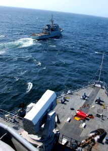US Navy 100417-N-6138K-685 The Spanish navy Servola-class offshore patrol vessel SPS Centinela (P 72) maneuvers forward of the Whidbey Island-class amphibious dock landing ship USS Gunston Hall (LSD 44)