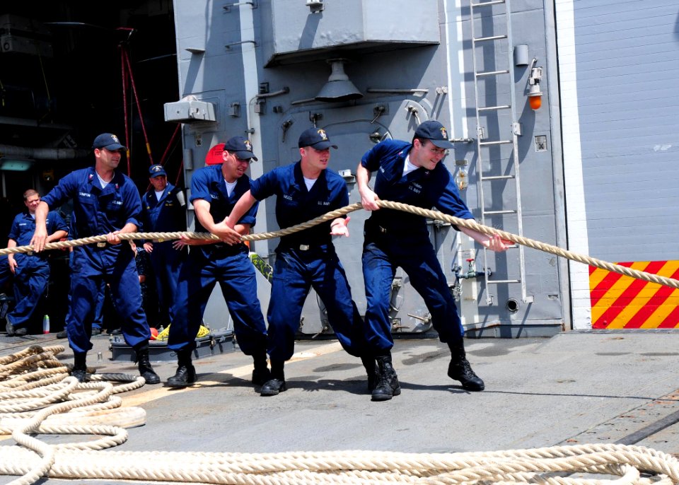 US Navy 100414-N-9301W-080 Sailors aboard the guided-missile frigate USS Klakring (FFG 42) take in mooring lines while departing St. Lucia