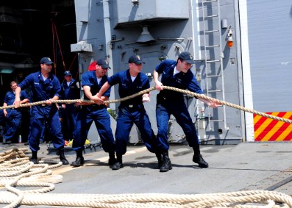 US Navy 100414-N-9301W-080 Sailors aboard the guided-missile frigate USS Klakring (FFG 42) take in mooring lines while departing St. Lucia