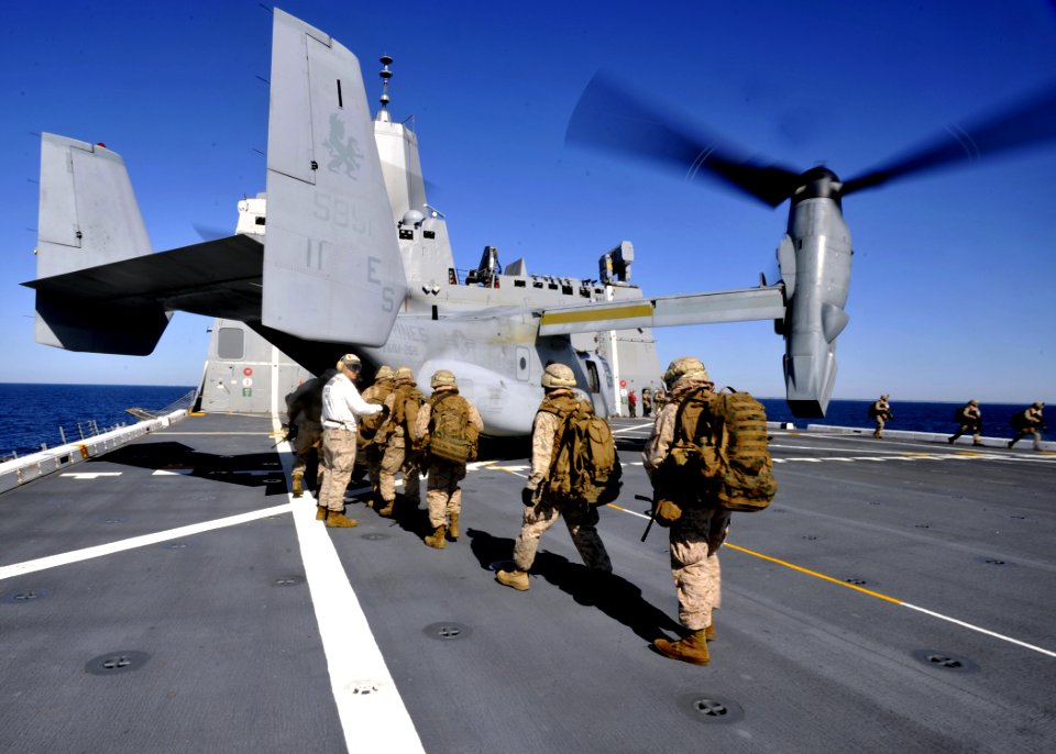 US Navy 100415-N-2147L-001 Marines assigned to India Company, 3rd Battalion, 9th Marine Regiment board an MV-22 Osprey aboard the amphibious transport dock ship USS New York (LPD 21)