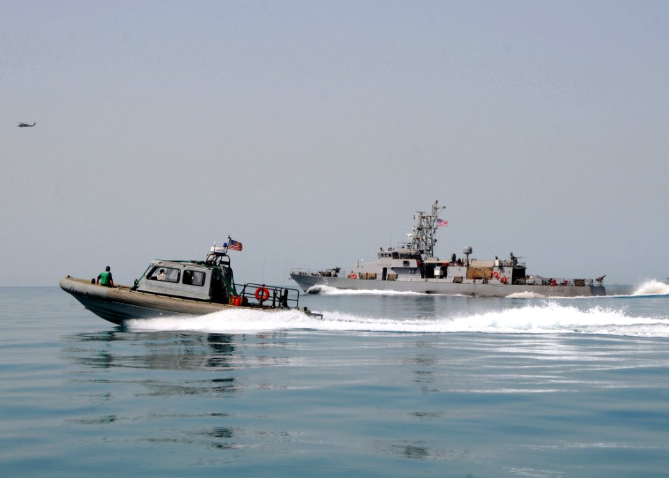 US Navy 100419-N-1082Z-167 A rigid-hull inflatable boat from the amphibious dock landing ship USS Ashland (LSD 48) and the costal patrol ship USS Typhoon (PC 5)