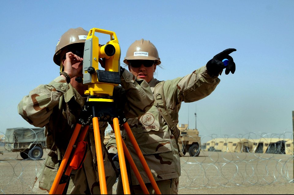 US Navy 100420-N-0475R-520 Steelworker Constructionman Shalyn Sathoff and Engineering Aide Constructionman Apprentice Ashley Cox ake measurements at a project site at Camp Leatherneck, Afghanistan