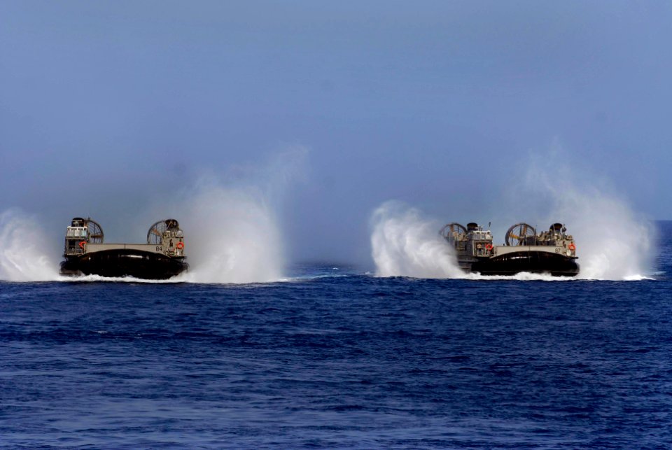 US Navy 100415-N-3358S-057 Landing Craft Air Cushion (LCAC) 84 and 87, both assigned to Assault Craft Unit (ACU) 4, conduct operations in the U.S. 5th Fleet area of responsibility
