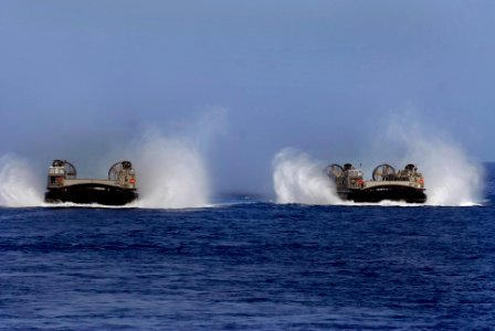 US Navy 100415-N-3358S-057 Landing Craft Air Cushion (LCAC) 84 and 87, both assigned to Assault Craft Unit (ACU) 4, conduct operations in the U.S. 5th Fleet area of responsibility