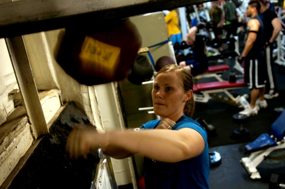 US Navy 100414-N-5712P-102 Aircrew Survival Equipmentman Airman Brittany Watson, from Ashville, N.C., hits the speed bag in the gym aboard the amphibious assault ship USS Nassau (LHA 4)