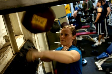US Navy 100414-N-5712P-102 Aircrew Survival Equipmentman Airman Brittany Watson, from Ashville, N.C., hits the speed bag in the gym aboard the amphibious assault ship USS Nassau (LHA 4)