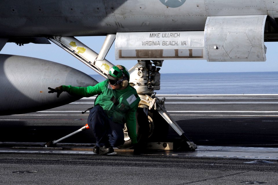 US Navy 100420-N-6509M-046 A Sailor assigned to the air department of the aircraft carrier USS George H.W. Bush (CVN 77) prepares an aircraft for launch