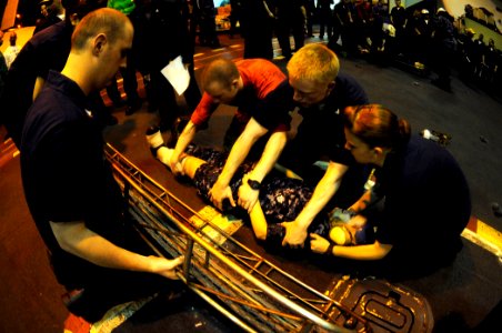 US Navy 100415-N-6604E-035 Sailors participate in a stretcher-bearer drill during the damage control Olympics aboard the aircraft carrier USS Dwight D. Eisenhower (CVN 69)
