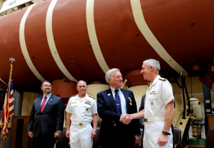US Navy 100415-N-7676W-101 Rear Adm. David Titley, Oceanographer of the Navy, congratulates retired Capt. Don Walsh, the first commander of the U.S. Navy bathyscaph Trieste