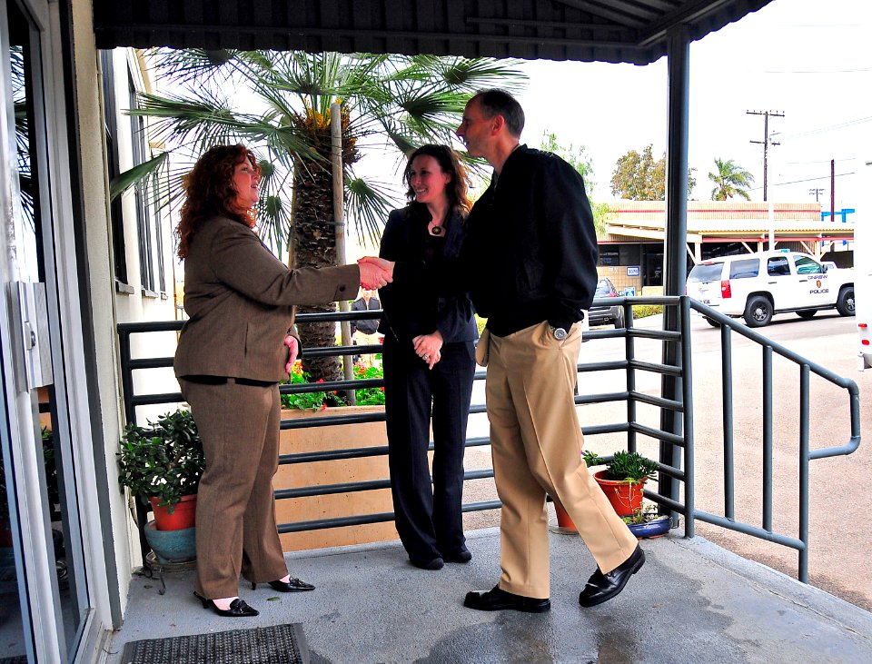 US Navy 100421-N-4774B-020 Vice Chief of Naval Operations (VCNO) Adm. Jonathan W. Greenert, right, greeted by Darleen Cope, education services coordinator, and Mary Kirby, program operations manager, at the Fleet and Family Sup